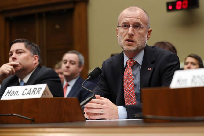 FCC Commissioner Brendan Carr testifies in a hearing.