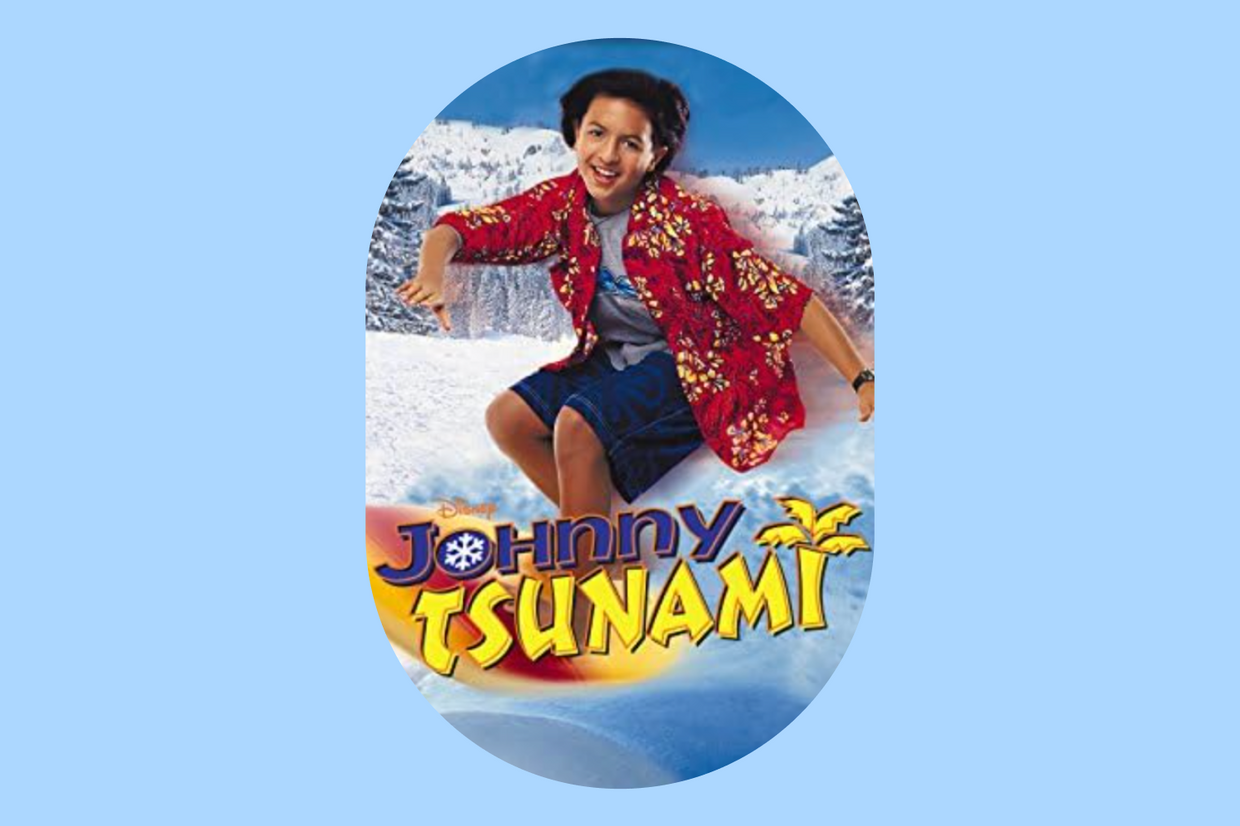 Johnny Tsunami promo photo. Johnny surfing through snow.