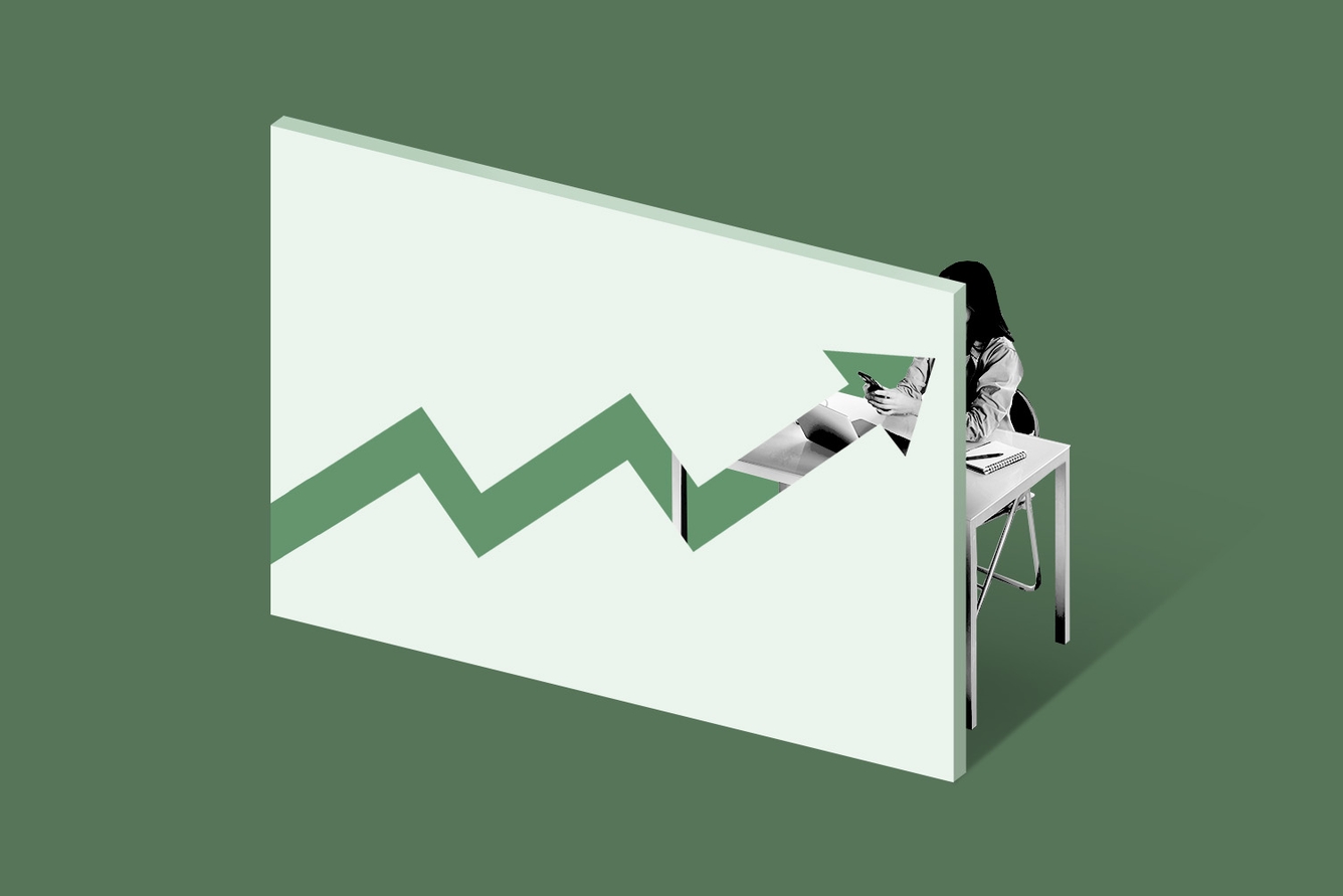 A cutout of an upward stock arrow on a wall with an office employee working behind. (Credit: Illustration: Anna Kim, Photo: Adobe Stock)
