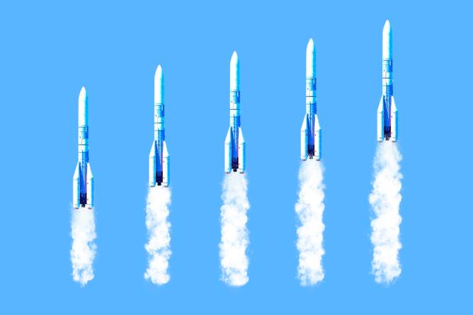 Space rockets forming a chart upwards