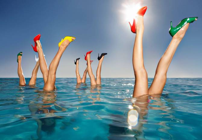 legs with high heels in water 