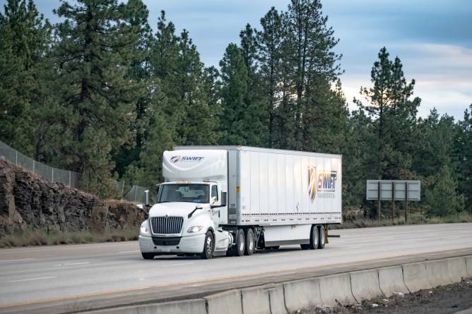 A semi truck on a highway.
