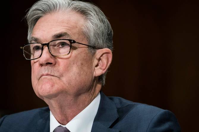 A shoulders-up photo of Fed Chair Jerome Powell looking off into the distance