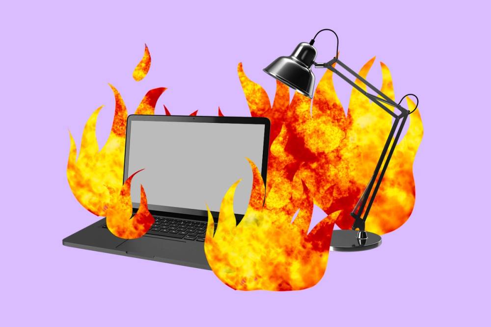 Laptop and desk lamp on fire.