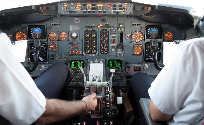 picture of pilot and co-pilot sitting in cockpit