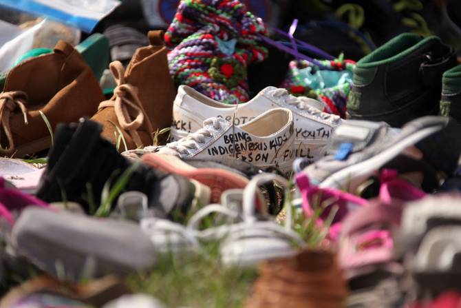 Shoes are placed at Ryerson Univerisity to mourn 215 indigenous children whose remains were discovered at a former residential school
