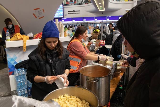 WARSAW, POLAND - 2022/03/07: Volunteers prepare hot meals and food supplies for the refugees who arrived in Warszawa Centralna Railway Station.