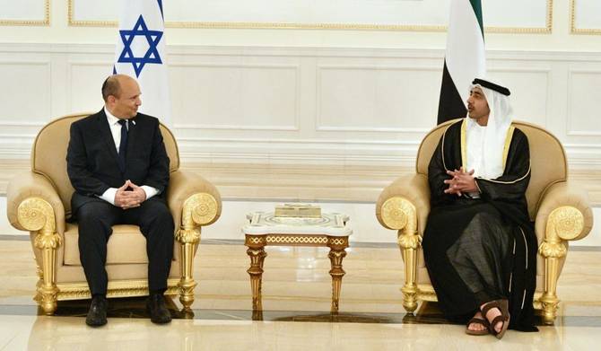 Israeli Prime Minister Naftali Bennett (L) welcomed by Abu Dhabi Crown Prince Mohammed bin Zayed Al Nahyan (R) in Abu Dhabi