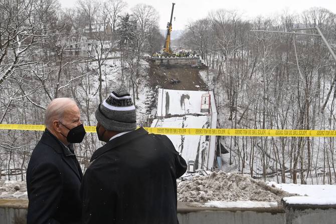 US President Joe Biden and the Mayor of Pittsburgh Ed Gainey visit the scene of the Forbes Avenue Bridge collapse over Fern Hollow Creek in Frick Park in Pittsburgh, Pennsylvania, January 28, 2022.