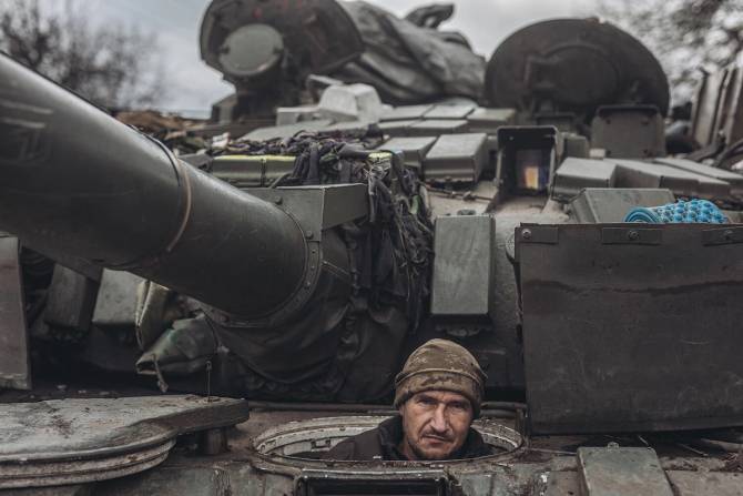 Ukrainian soldier in a tank