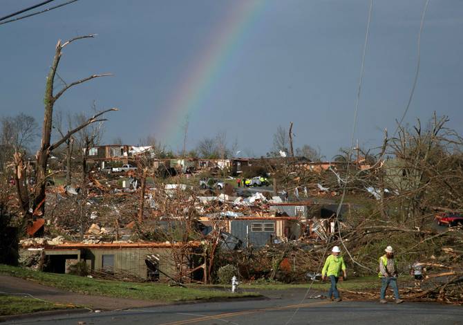 A rainbow shines amidst the remains of a neighborhood damaged by a tornado on March 31, 2023 in Little Rock, Arkansas.