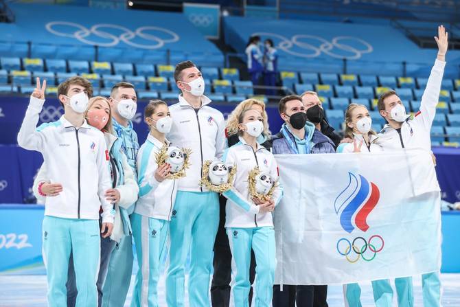 Gold medalists of team ROC pose for a group photo during the flower ceremony of the figure skating team event at Capital Indoor Stadium in Beijing, capital of China, Feb. 7, 2022.