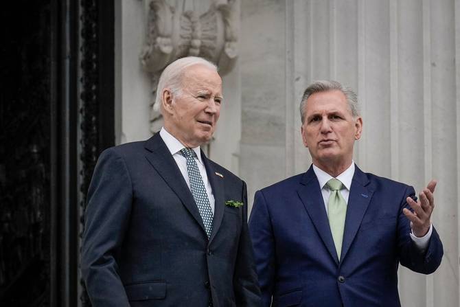 U.S. President Joe Biden and Speaker of the House Kevin McCarthy (R-CA) talk as they depart the U.S. Capitol 