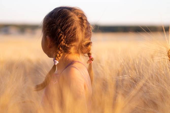 image of little girl in a field