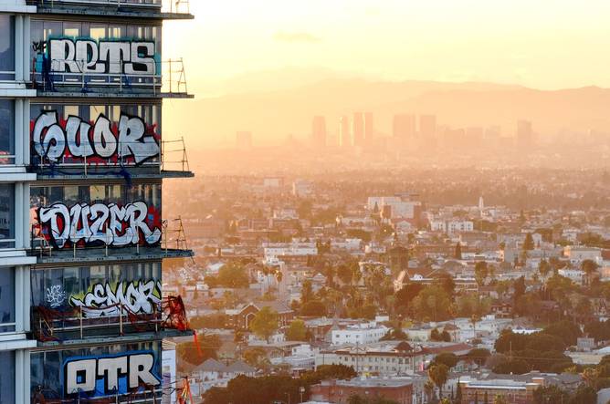 An aerial view of graffiti spray painted by taggers on at least 27 stories of an unfinished skyscraper development located downtown on February 2, 2024 in Los Angeles, California