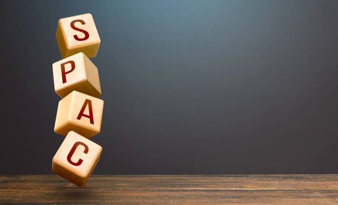4 wooden blocks with the letters "S P A C" engraved on them