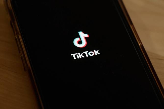 TikTok logo on a mobile phone screen