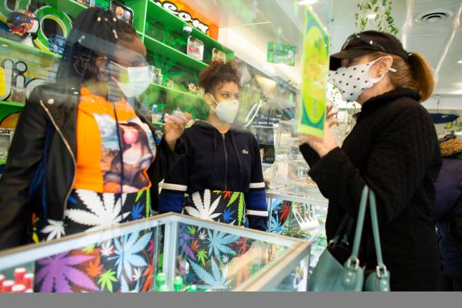 Three women inside a cannabis store.