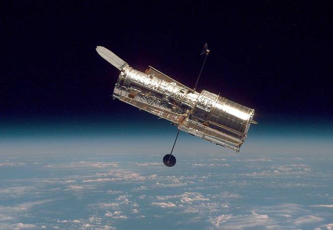 The Hubble Space Telescope drifts through space.