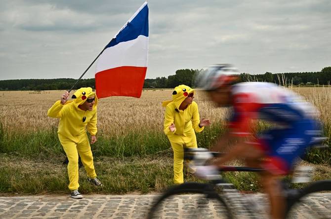 Fans cheer on the Tour de France cyclists