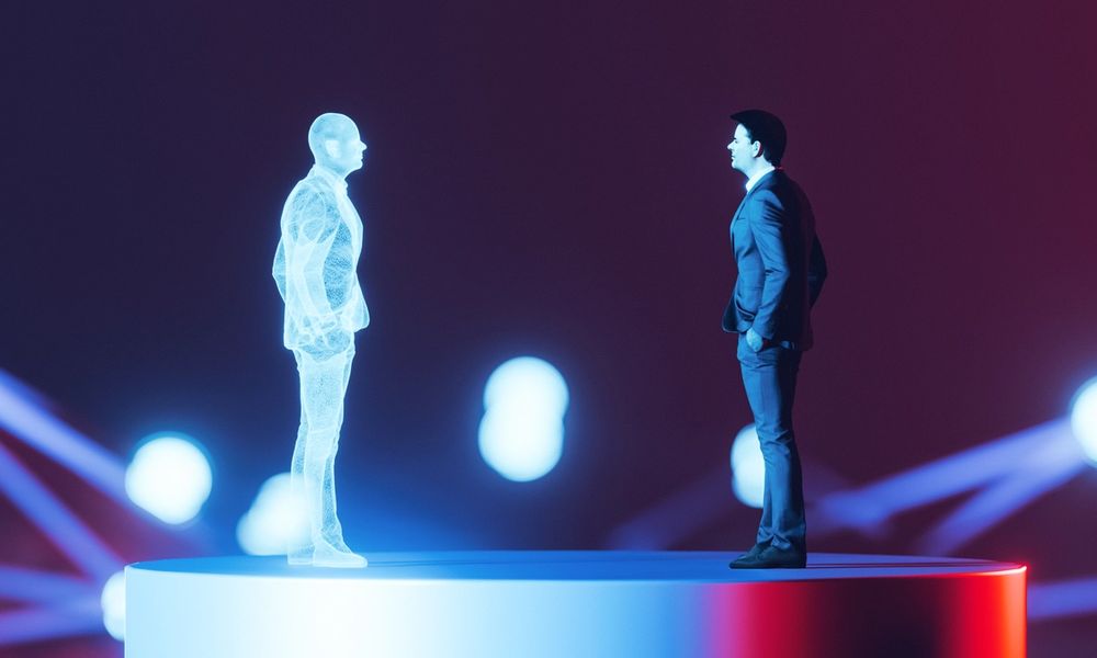 A man in a suit stands on a platform across from an avatar.