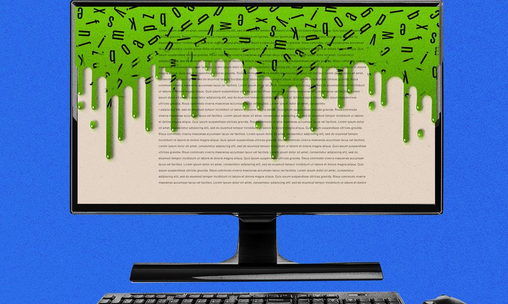 A desktop computer that has green goop spilling from the top of the screen