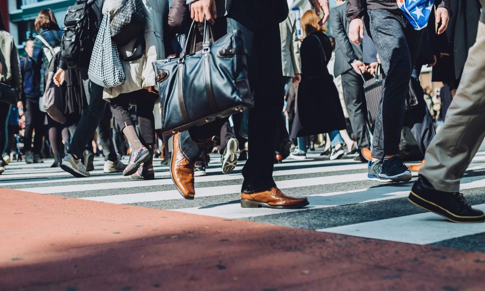 People walking across the street