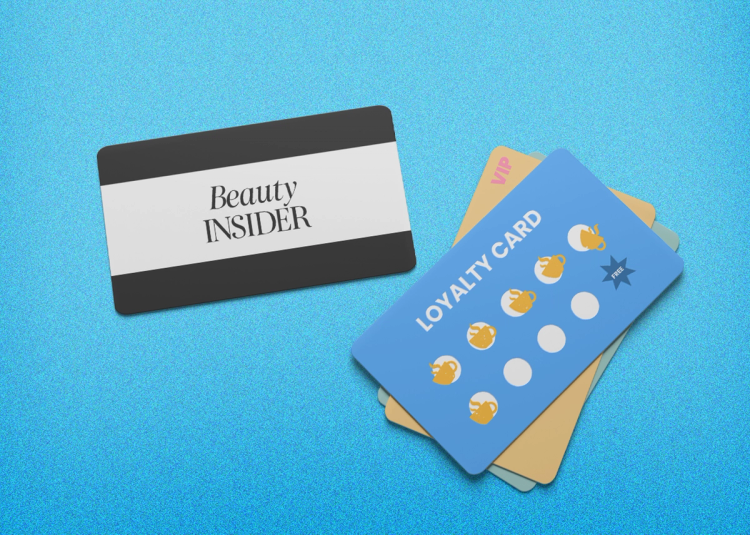 A beauty loyalty card next to a generic customer loyalty card