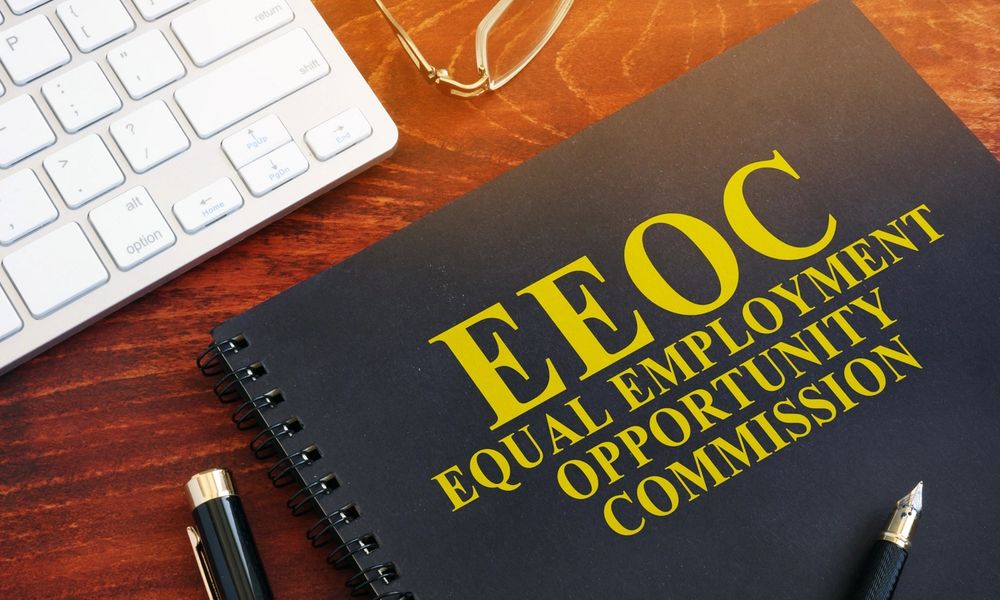A black book with EEOC on the cover