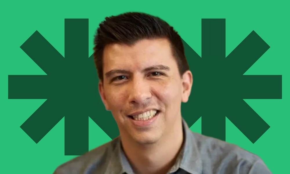 Photo of Tony Castellanos, a man with short brown hair, smiling and wearing a button-down shirt.