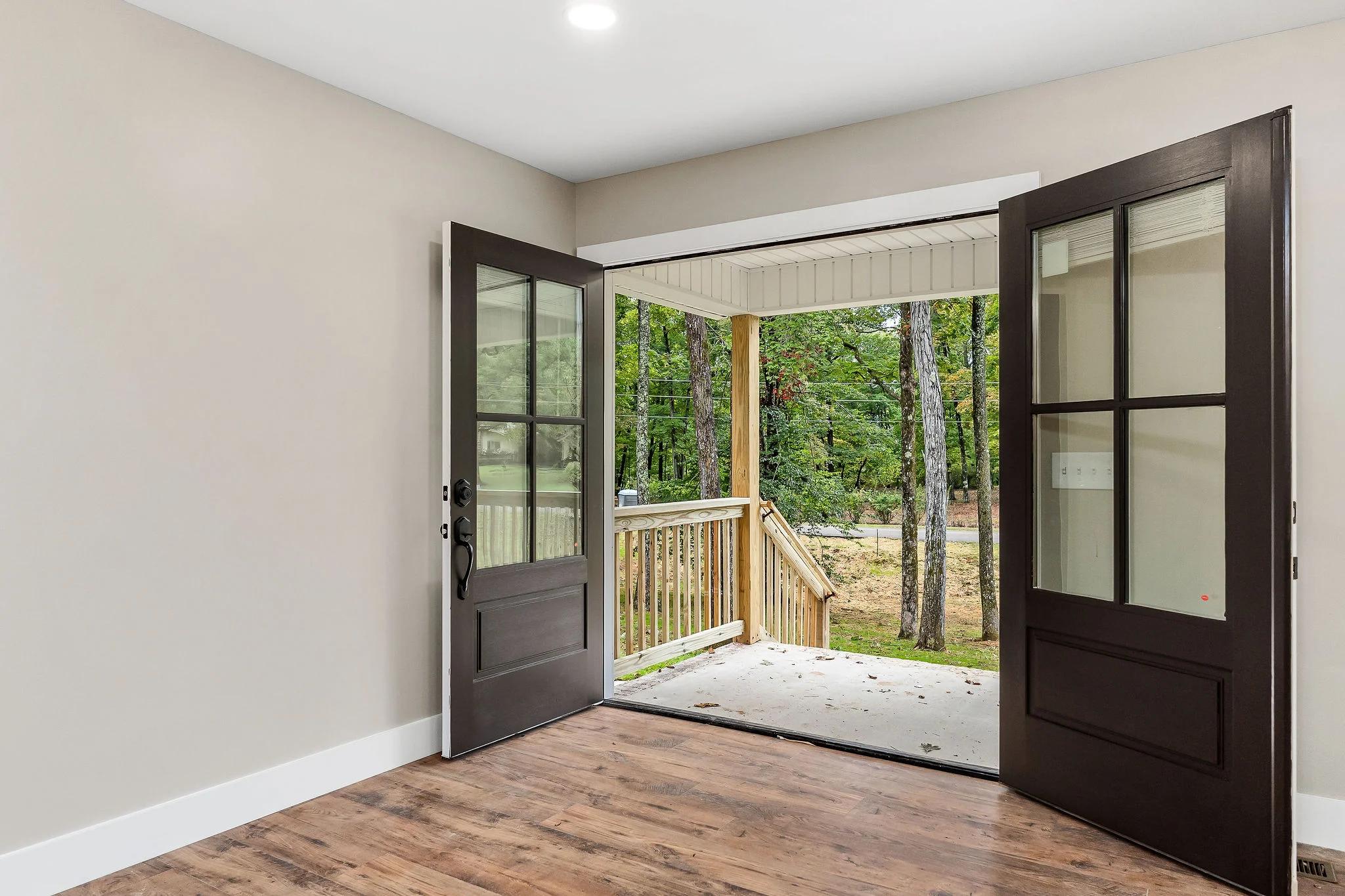Inside home looking out open front doors