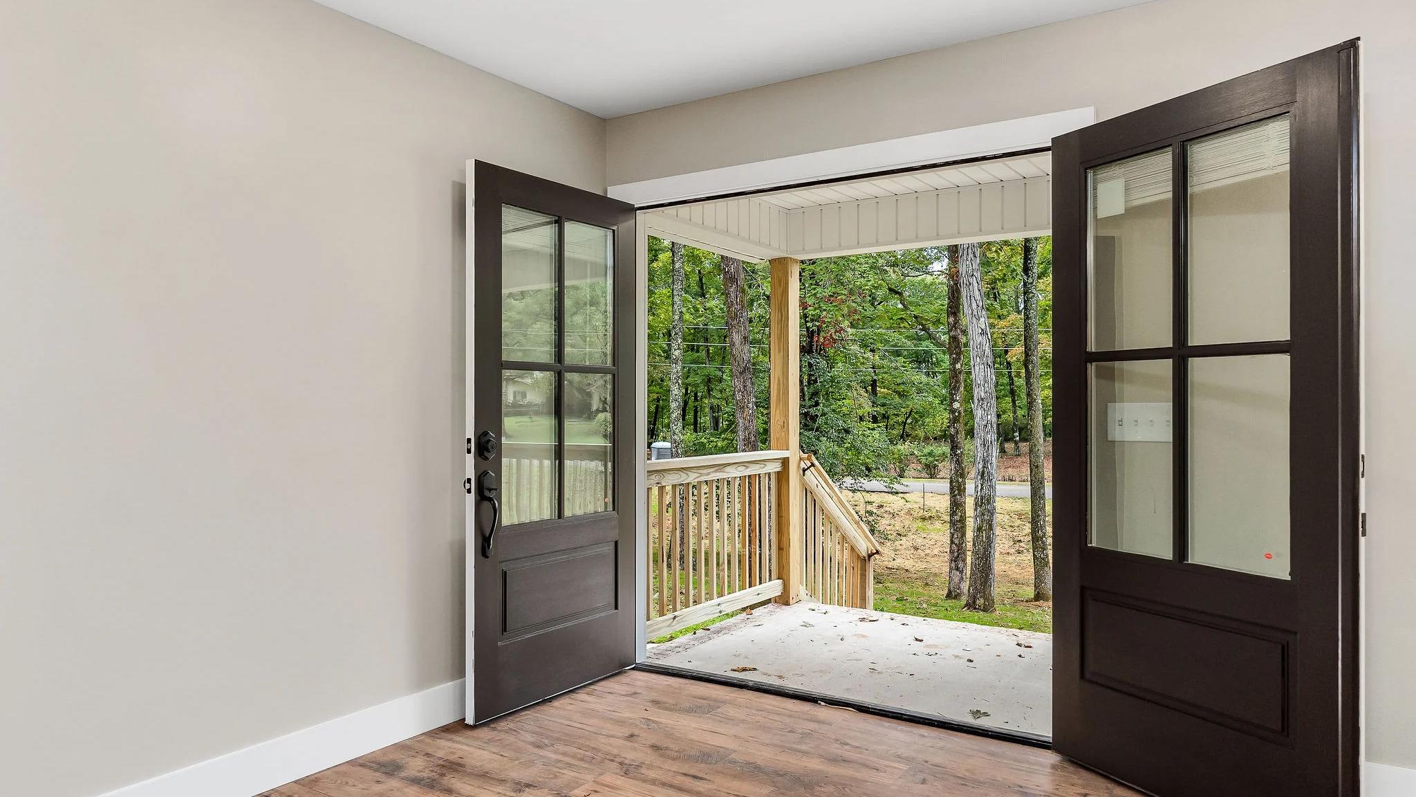 Inside home looking out open front doors