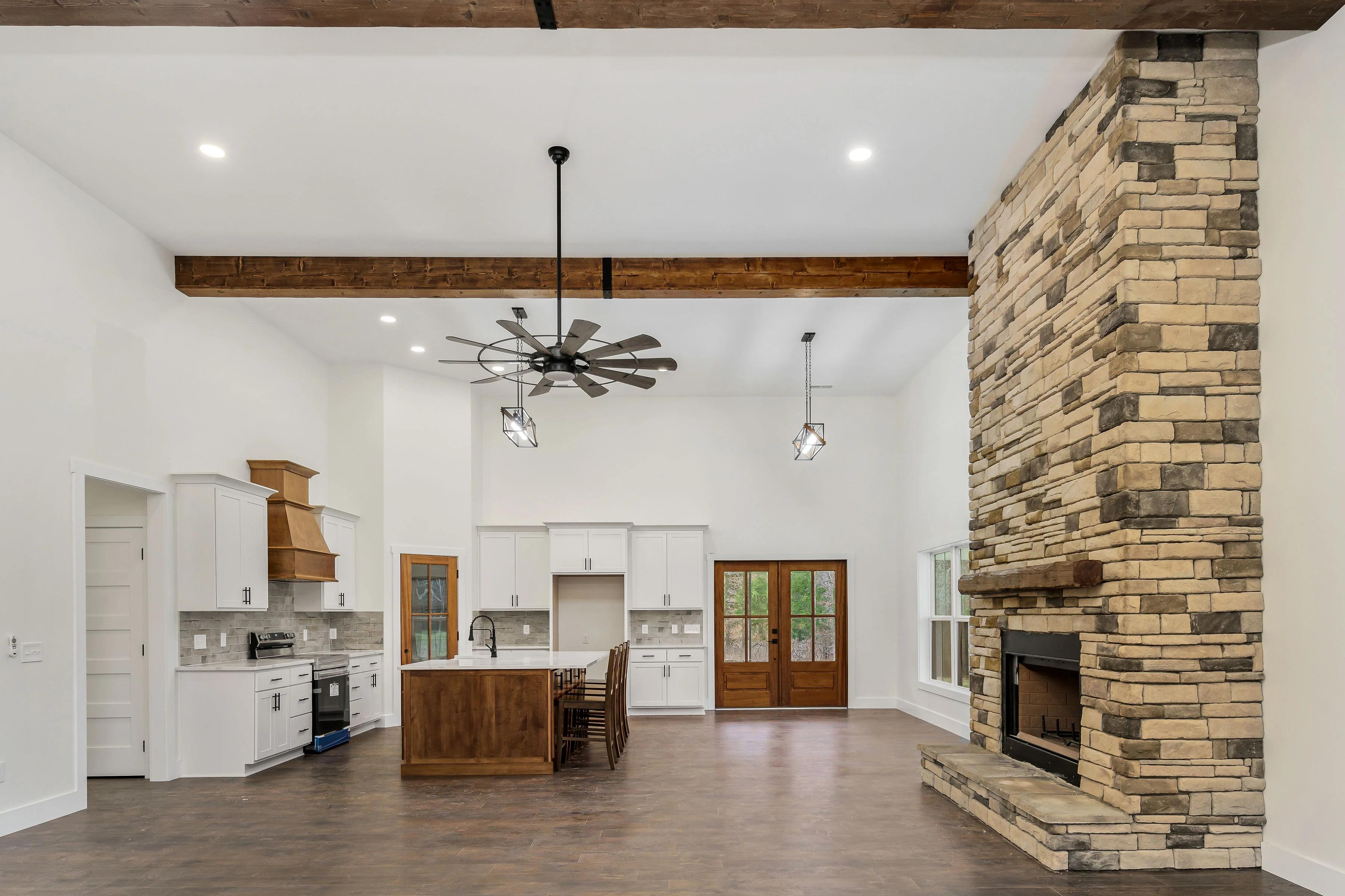 Inside of home looking into the kitchen from the living room