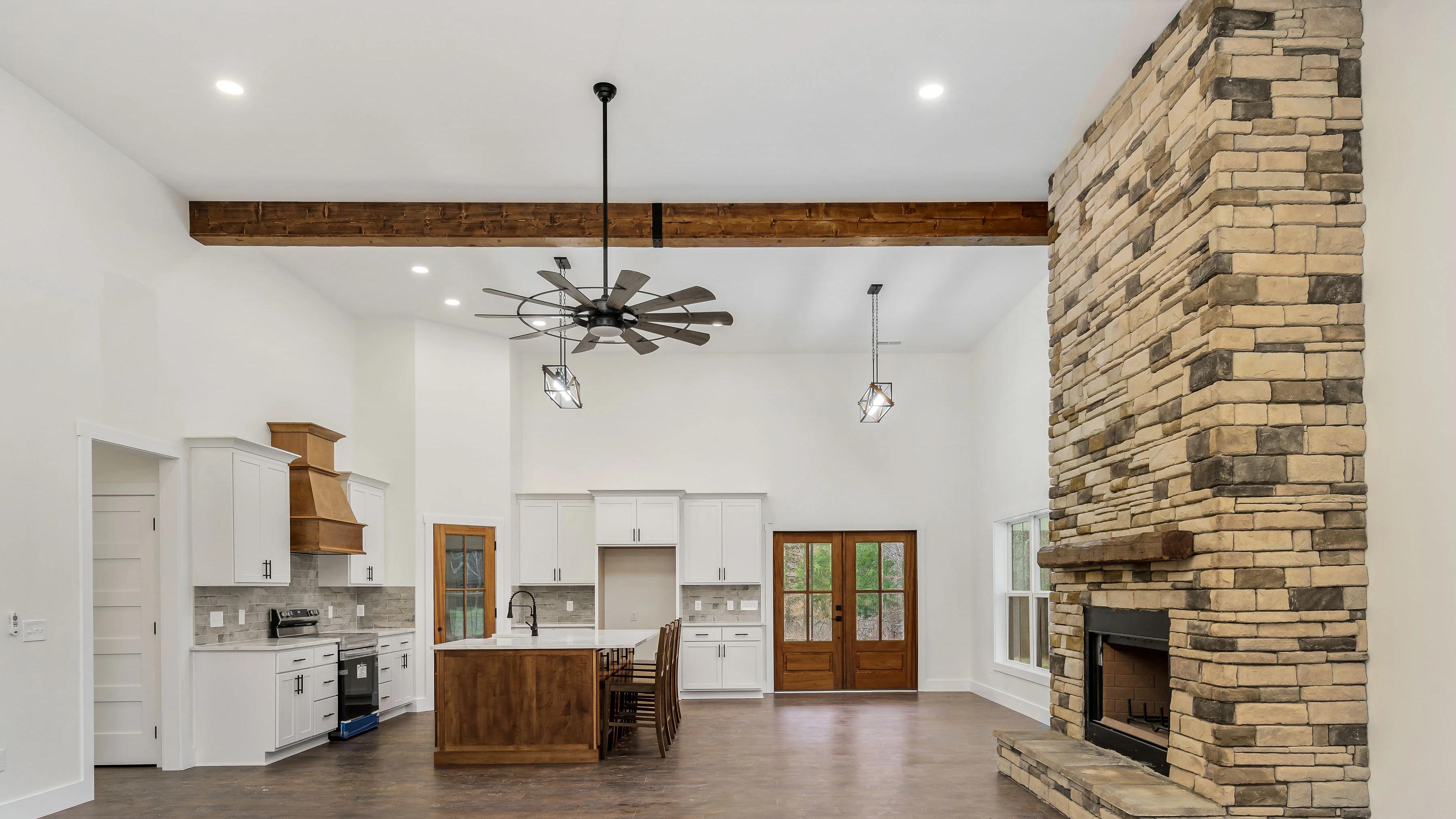 Inside of home looking into the kitchen from the living room
