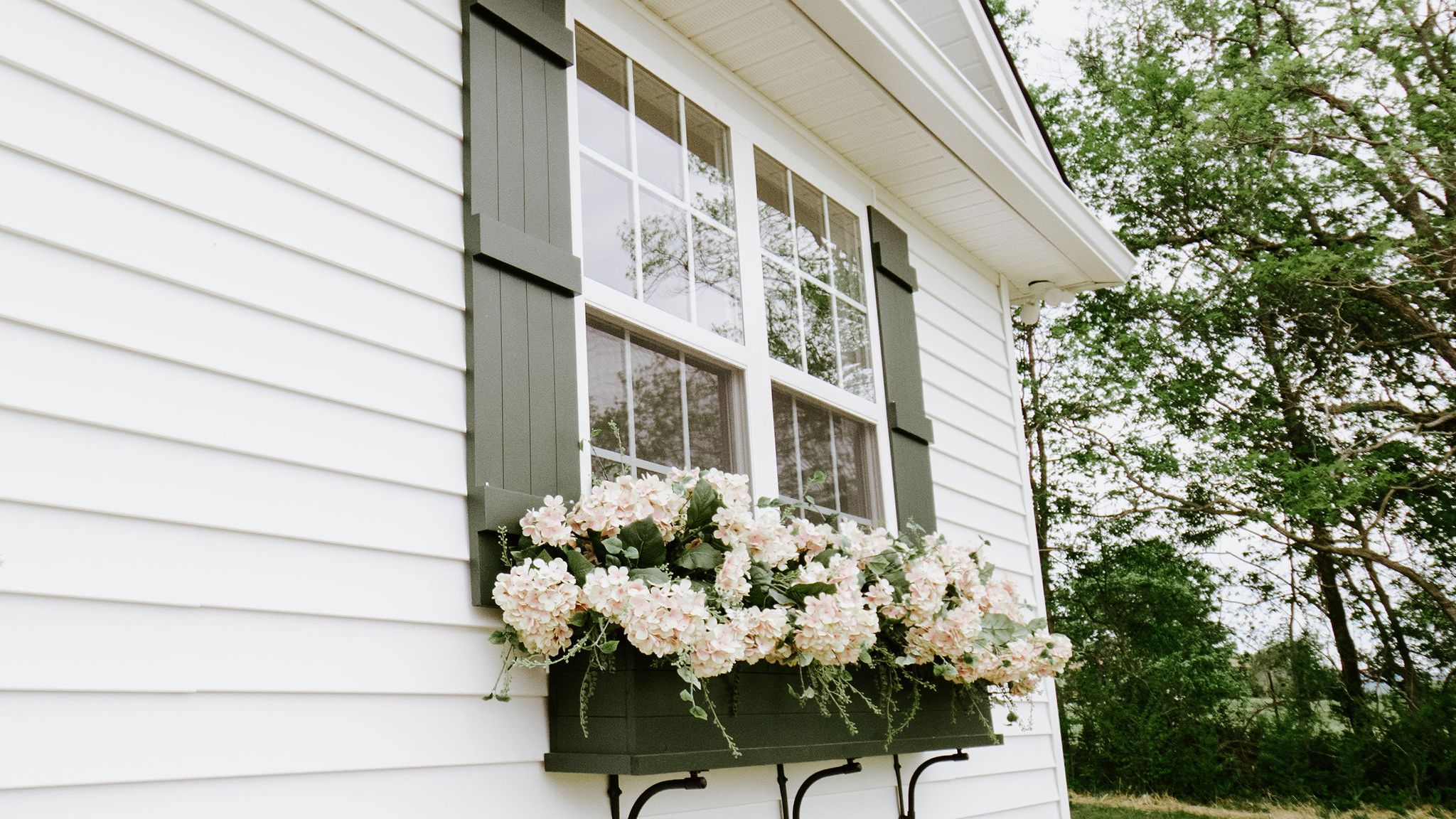 Side of home with flowers