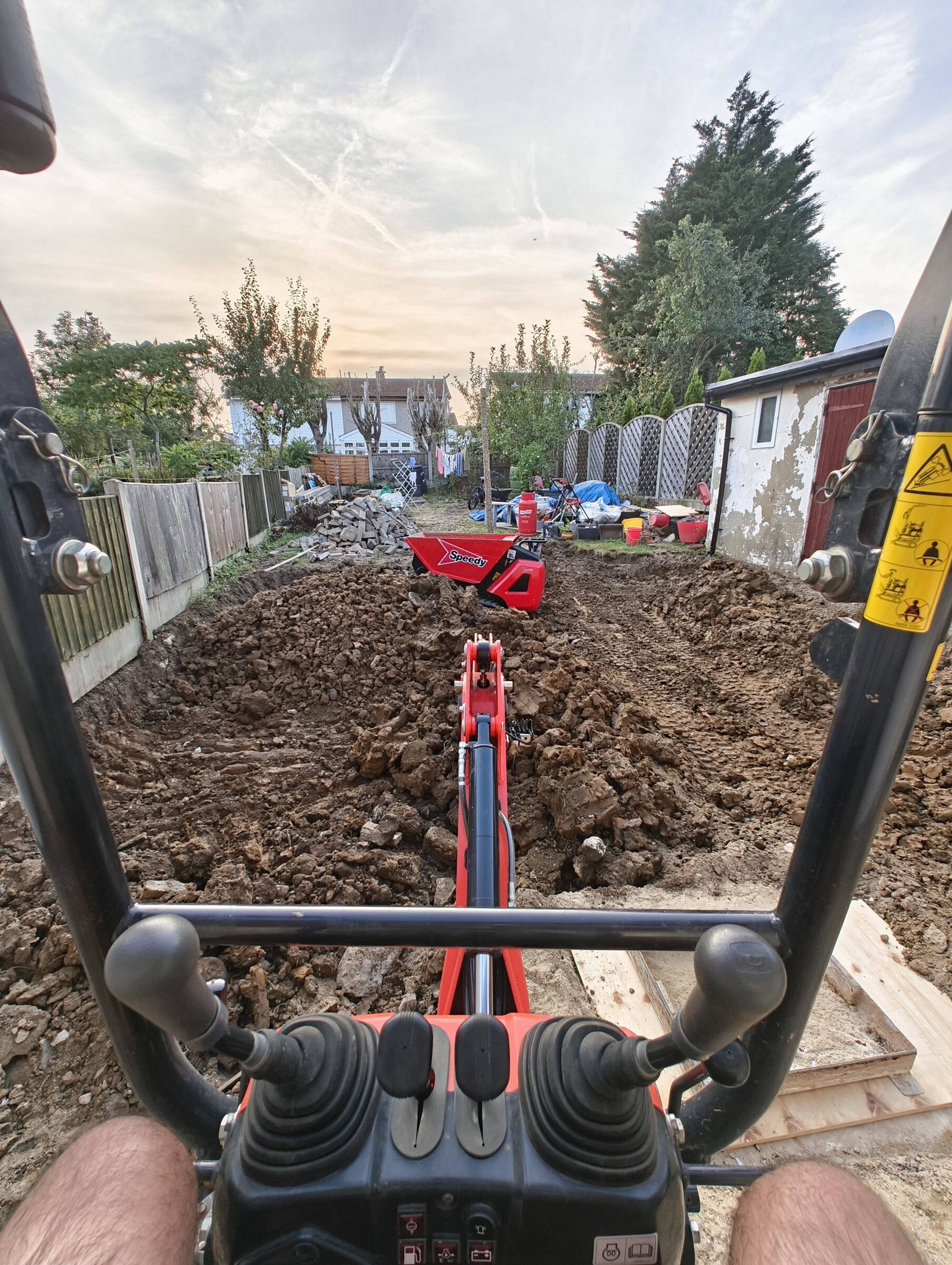 View from the mini digger cab over the excavated rear garden for a Chigwell rear extension.