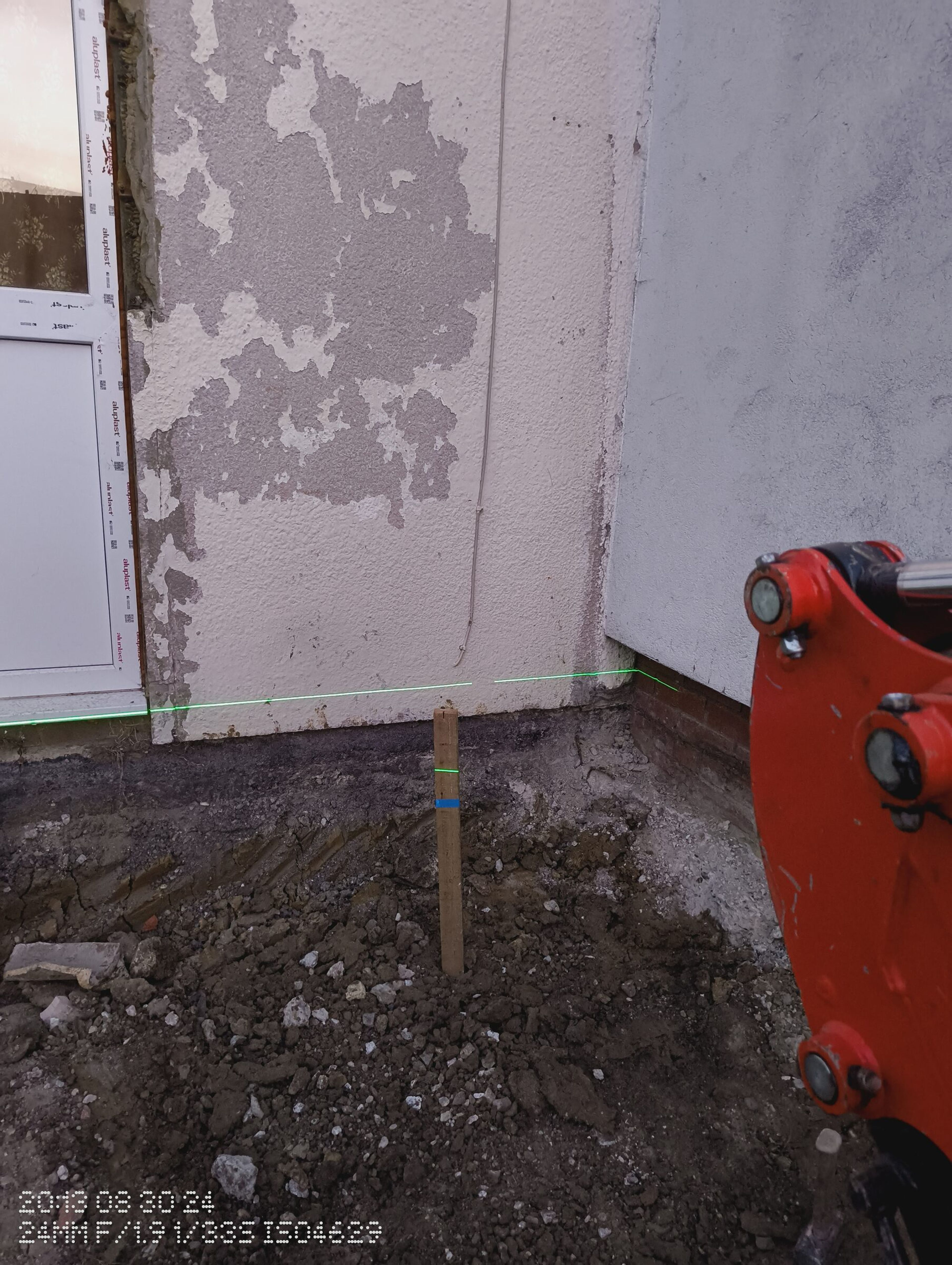 Mini digger and laser level used to level the ground for a Chigwell rear extension.