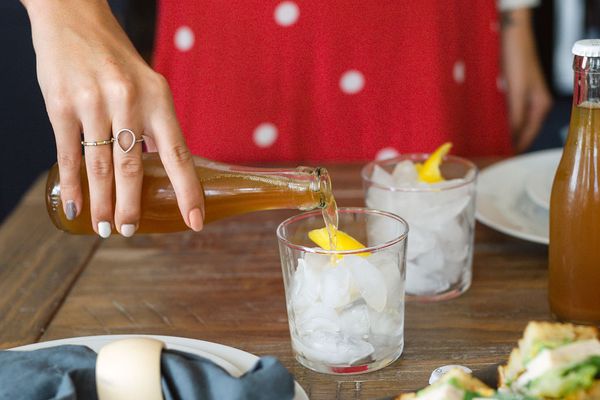 Private chef preparing drinks and plated food at a Respite and Revelry vacation rental dinner in Charleston SC