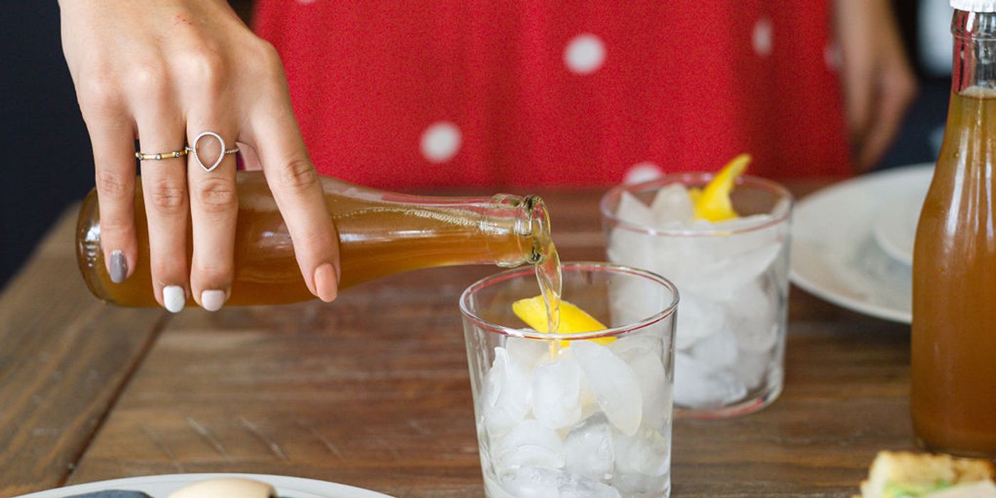 Private chef preparing drinks and plated food at a Respite and Revelry vacation rental dinner in Charleston SC