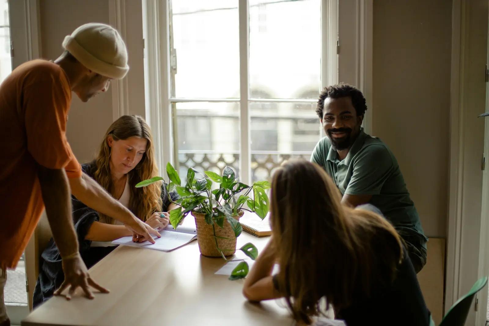 Small business team reviewing financial documents together at a table
