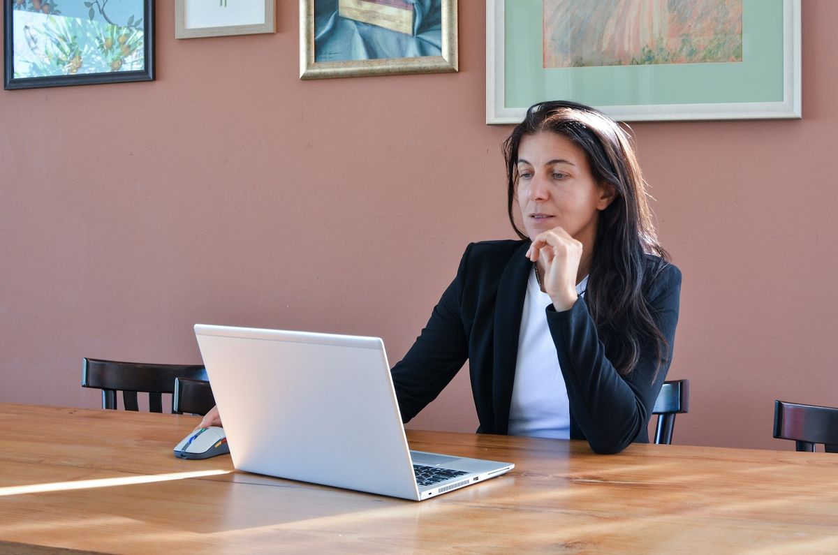 Entrepreneur reviewing Illinois LLC formation paperwork and startup costs