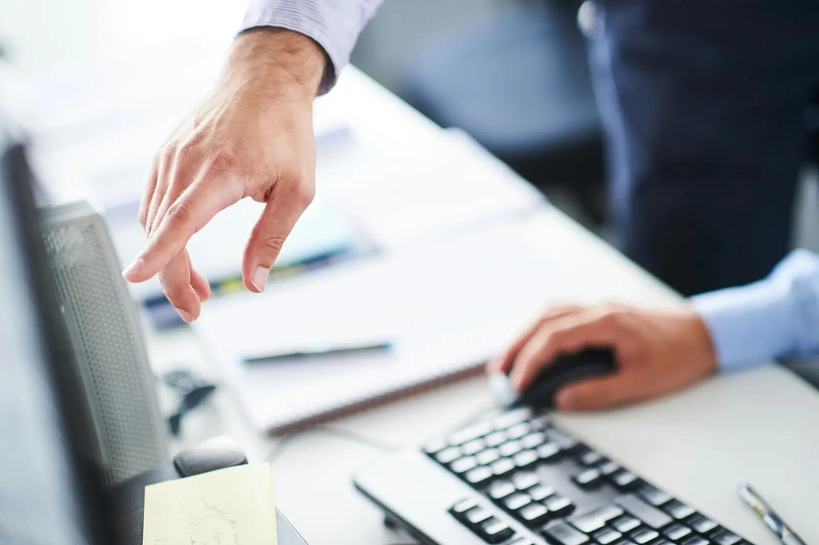 A business owner compares virtual mailbox providers at their desk.