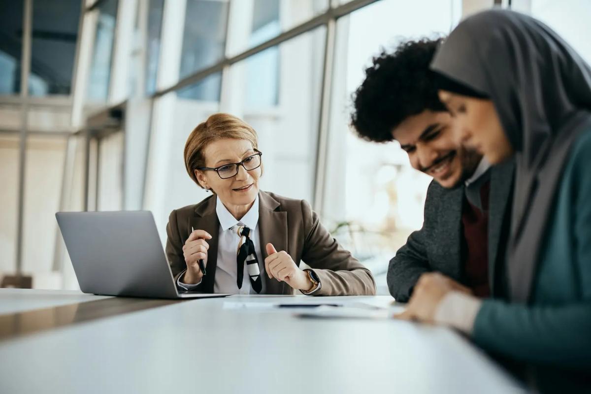 Finance professionals collaborating using a digital mailroom dashboard for routing, approvals, and document management