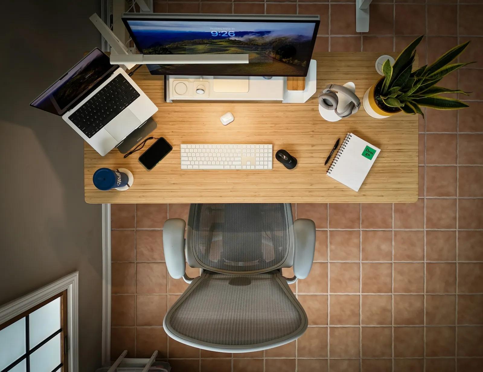 Top-down view of a clean, organized desk setup representing efficient office management