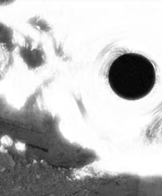 a black and white photo of a black hole in the ground .