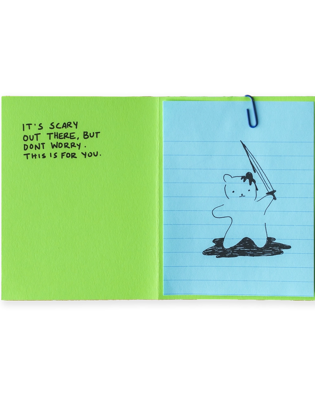 A lime green paper with partial black text folded over light blue lined paper with a partial black drawing.