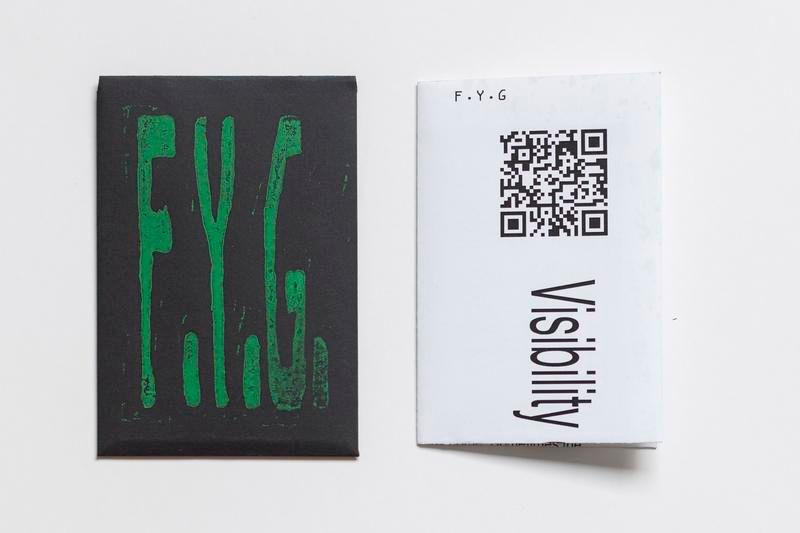 a black and white piece of paper with a qr code on it .