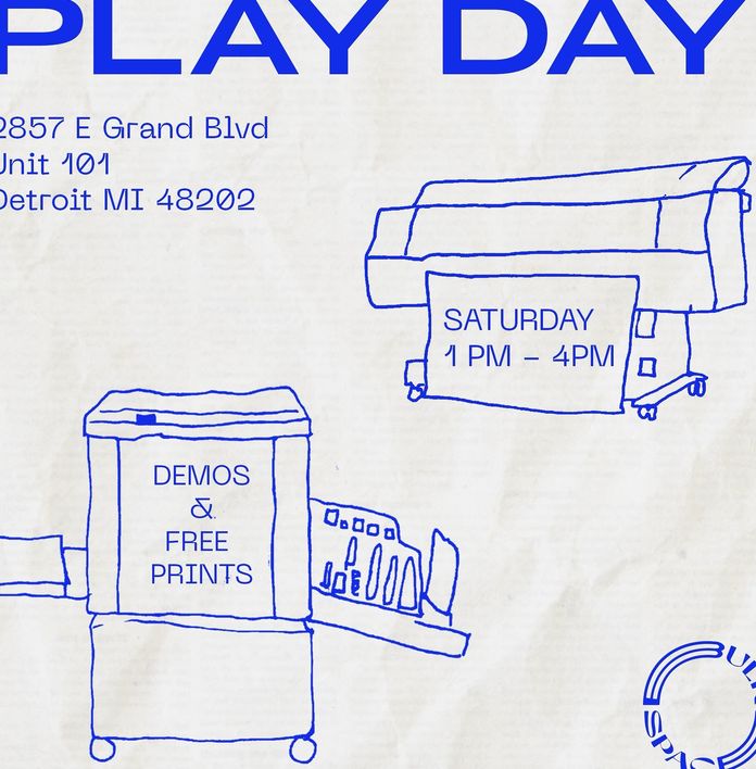 a blue drawing of a printer and a sign that says play day