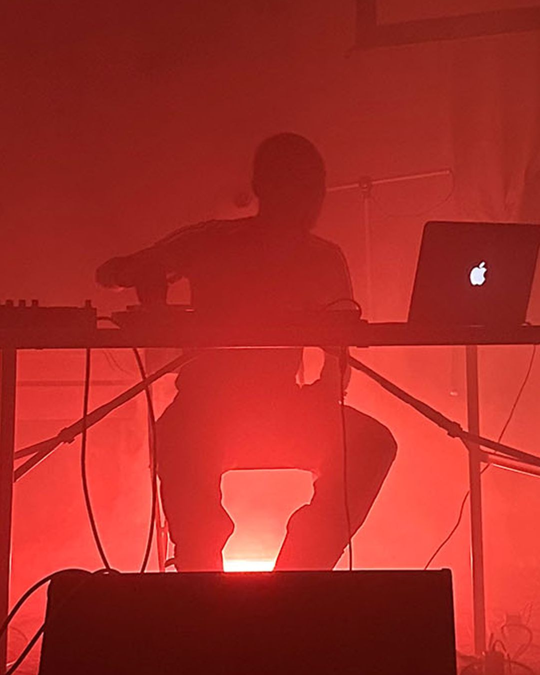 Flyer for XTL: The Audio Workshop, 'Intro to Ableton,' with Kat Nzingha. October 3, 6-8PM and October 4, 2-4PM, at Bulk Space Media Lab, 2857 E. Grand Blvd. The image shows a silhouette of a person at a table with a laptop and audio equipment, bathed in red light.