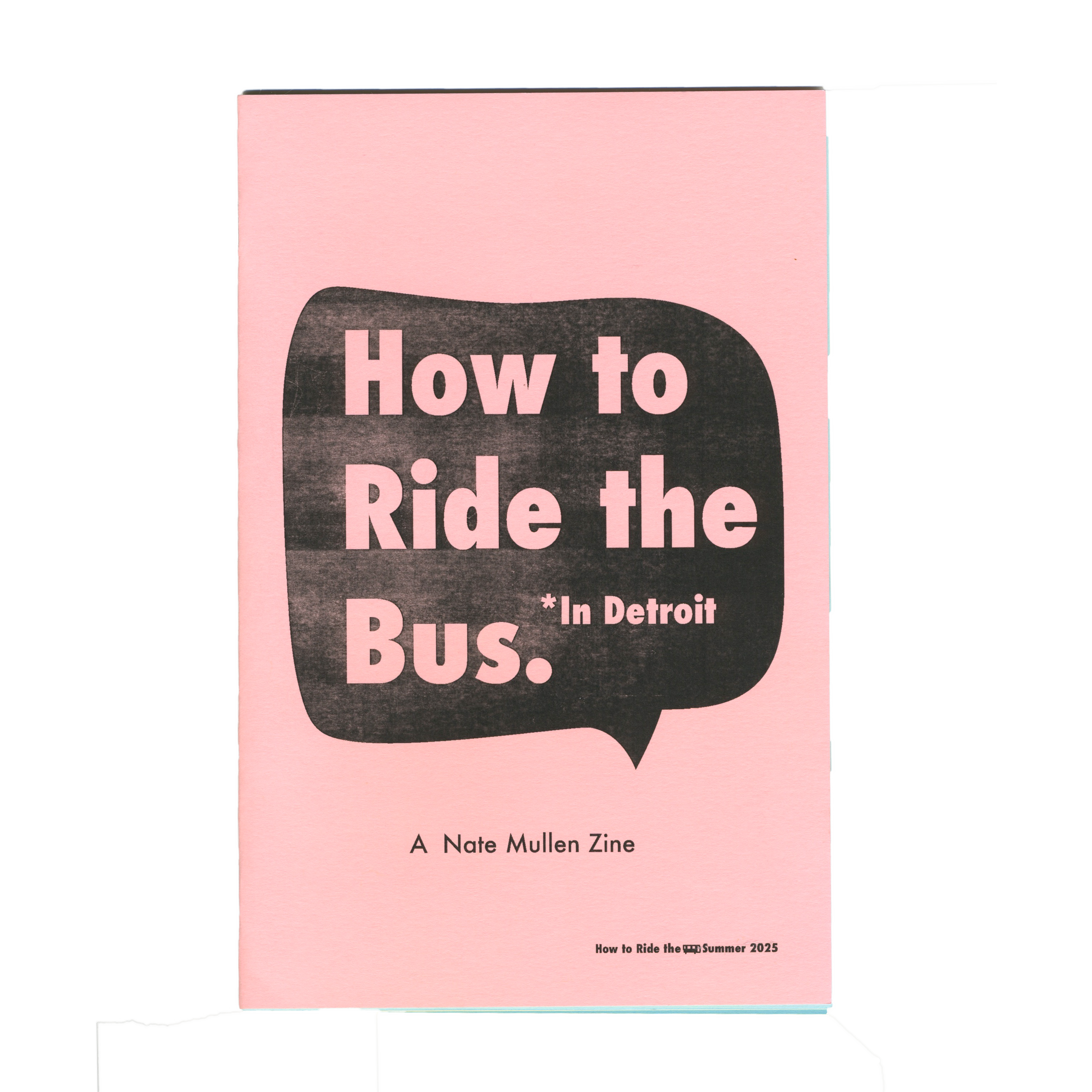 Pink zine cover titled "How to Ride the Bus. *In Detroit" inside a black speech bubble, by Nate Mullen.